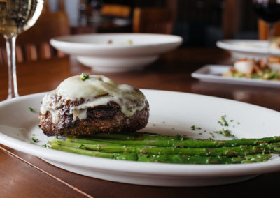 Johnny's Italian Steakhouse topped steak with asparagus