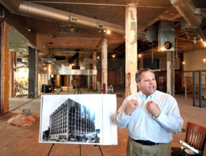 Kirk Whalen presenting the 5th avenue building in downtown Moline, Illinois