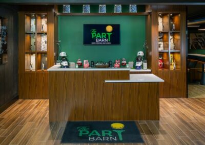 ParT Barn desk with golf hats, shirts, and golf balls available