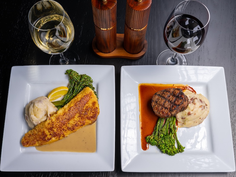 ParT Barn plates with professionally decorated dinner food, wine glasses, and wood salt and pepper shakers